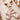 Doudou plat cerf en minky beige et double gaze dans un berceau.