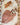 Doudou lion personnalisable niché dans sa feuille