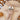 peluche lapin pour enfant en minky beige, posée dans un berceau.